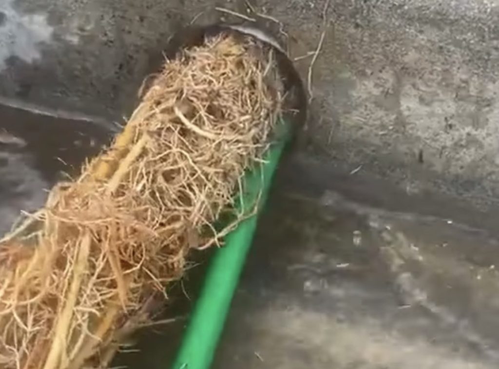 Drain tile hydro jetting