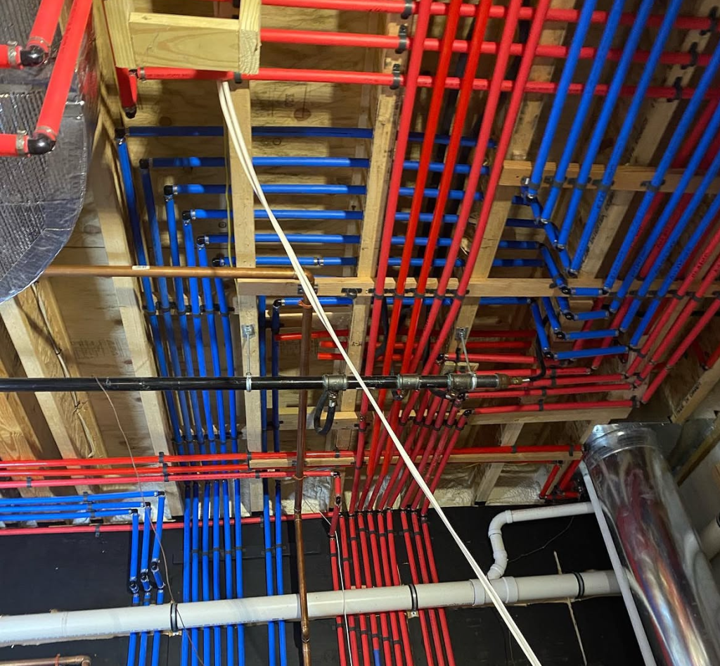 Plumber repairing hidden water leak and damaged pipe in Vancouver