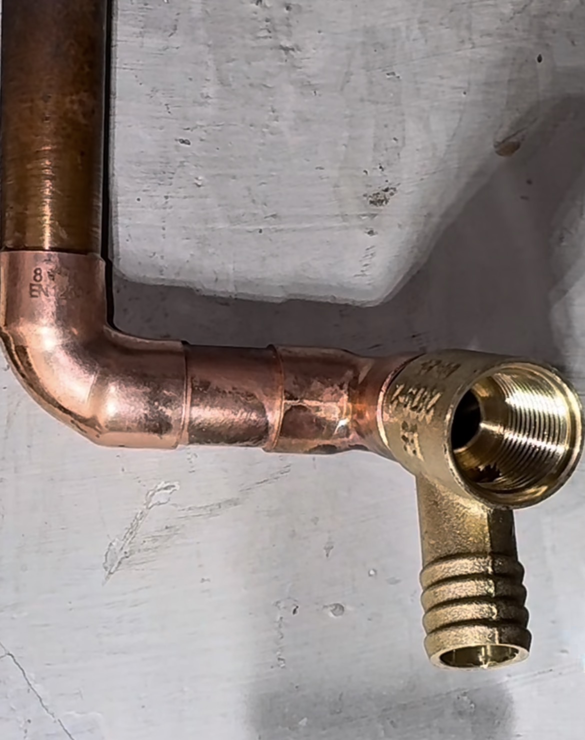 Copper plumbing pipe installation and residential water line connection repair in Vancouver