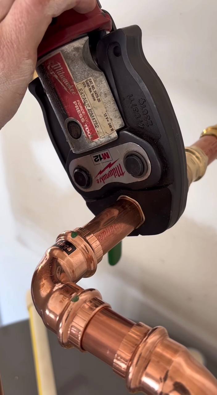 Plumber repairing hidden water leak and damaged pipe in Vancouver